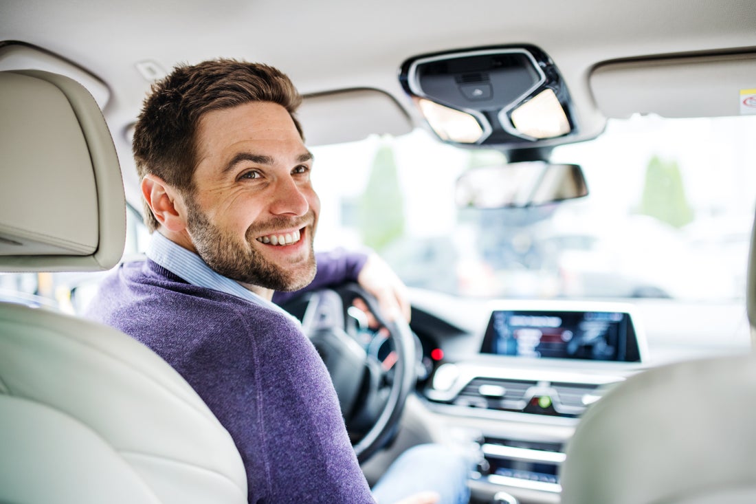 a man driving a car